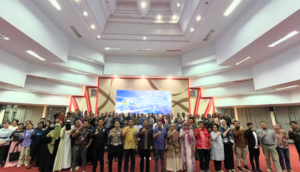 Large group posing at indoor conference event