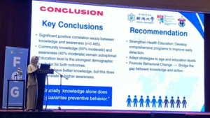 Presenter discussing key conclusions and health recommendations slide