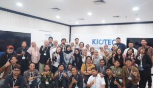 Large team posing in office lobby