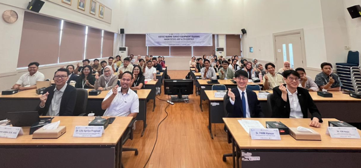 Group training seminar participants posing in classroom