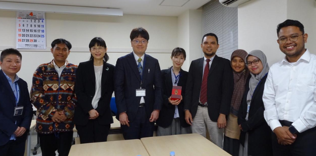 Group of professionals posing in office meeting room