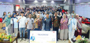 Large group posing at indoor talk show event