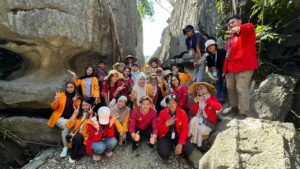 Group posing in rocky canyon outdoors