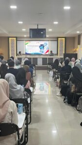 Students attending pharmacoeconomics lecture in auditorium