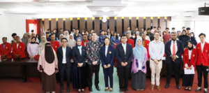 Large group of students and faculty in classroom