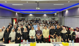 Large group photo in university lecture hall