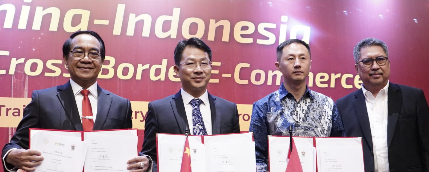 Officials holding signed agreements at China-Indonesia event