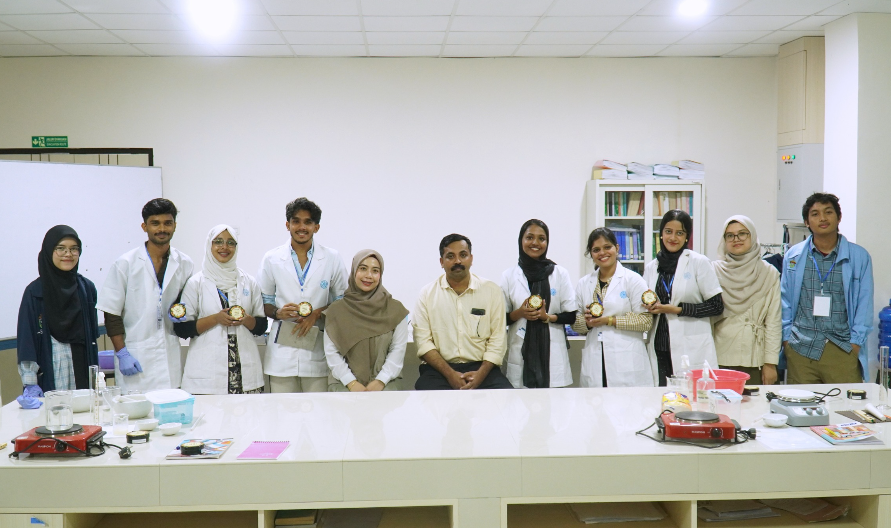 Group of students holding awards in laboratory classroom