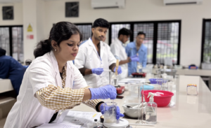 Students conducting chemistry experiment in laboratory classroom