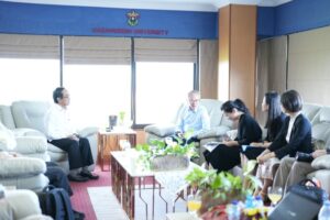 University meeting in lounge with seated participants