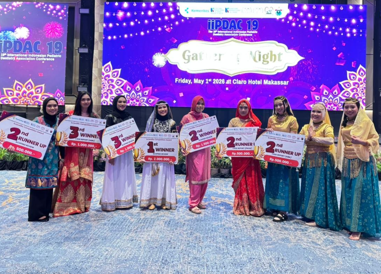 Women holding winner checks at gala event