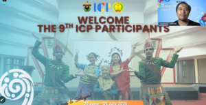 Welcome banner with traditional dancers and speaker inset