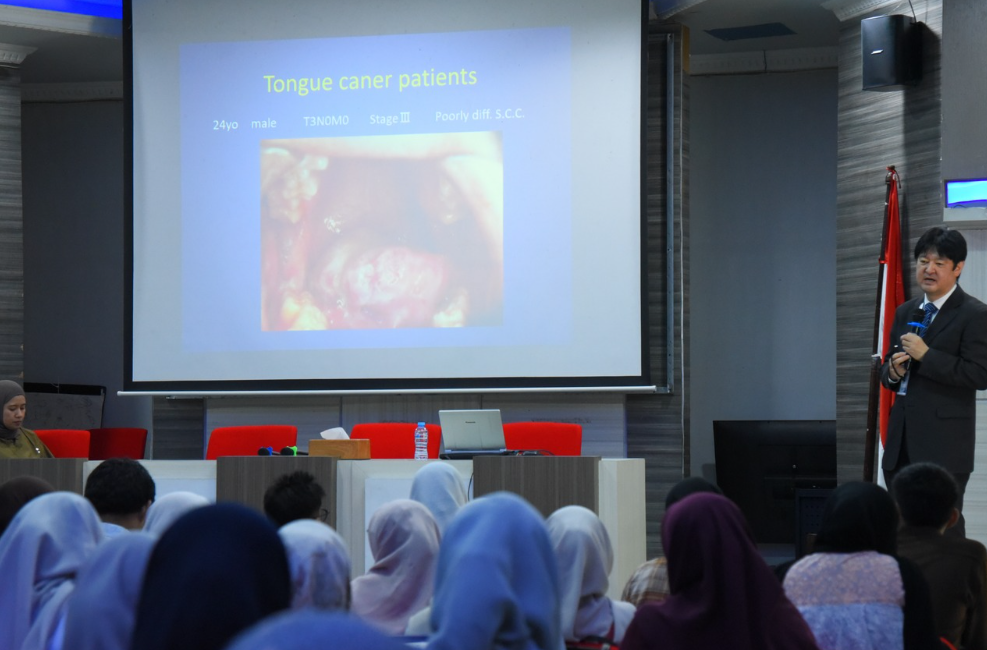 Doctor presenting tongue cancer case study slide