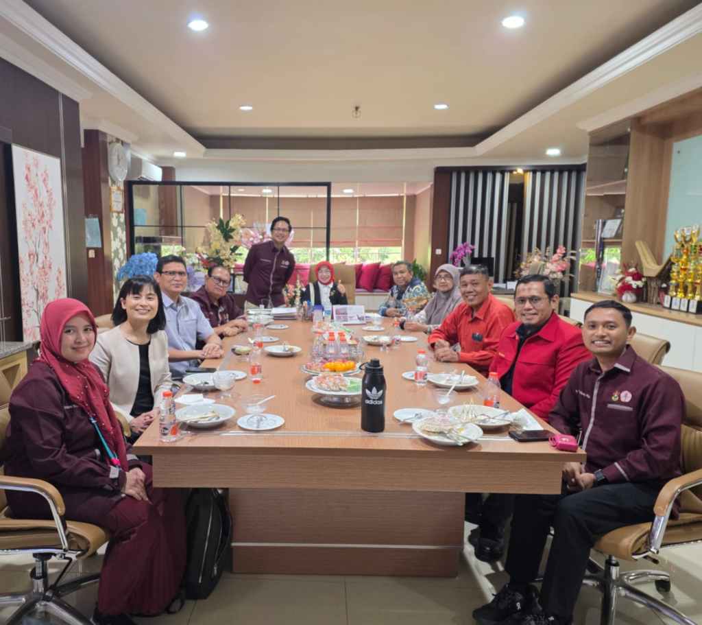 Team meeting around conference table in office