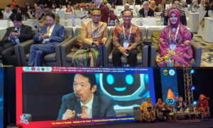 Conference attendees in traditional attire at symposium event