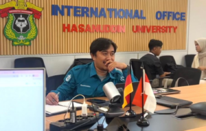 University international office meeting with flags on table