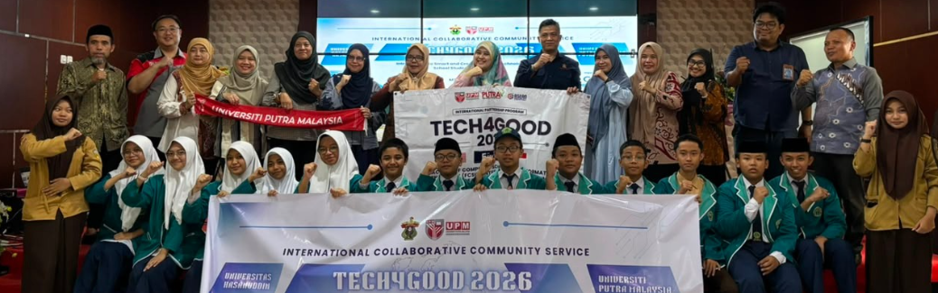 Students and educators holding TECH4GOOD 2026 banner