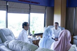 University meeting in office with four people
