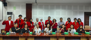 Group of people posing in conference room
