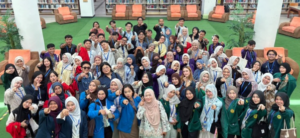 Large group of students posing in library