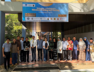 Group photo under training and meeting banner