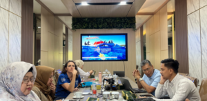 Team meeting in modern conference room with screen