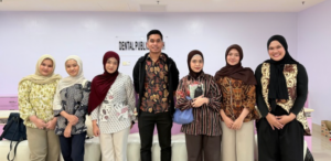 Group of seven people standing in dental clinic
