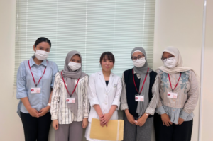 Five women posing in medical office setting