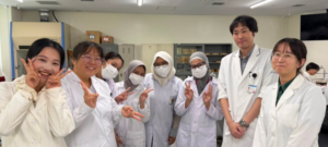 Group of researchers posing in laboratory coats