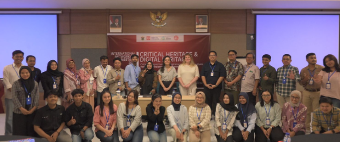 Conference group photo in front of heritage banner