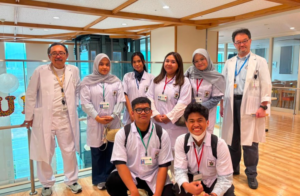 Medical team posing in hospital corridor