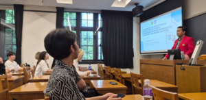 Instructor presenting to students in classroom lecture