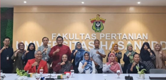 Group posing at university agriculture faculty office
