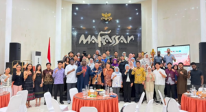 Large group posing in Makassar hall