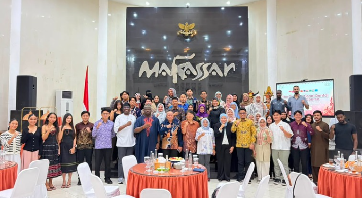 Large group posing in Makassar hall