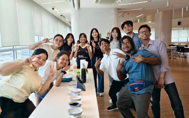Group of young adults posing indoors