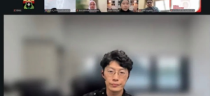 Man on a virtual meeting with participant thumbnails above