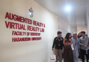 Students outside Hasanuddin University augmented and virtual reality lab