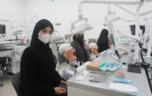Dental students practice in a clinical simulation laboratory