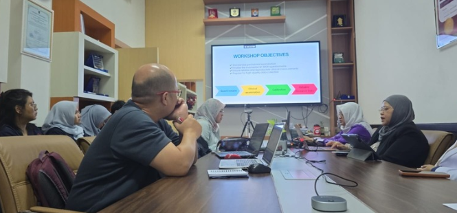 Colleagues attend workshop presentation in conference room