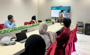 Presenter addresses attendees during a meeting room presentation