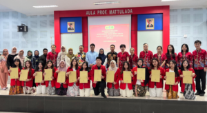 Students and faculty pose with certificates at ceremony