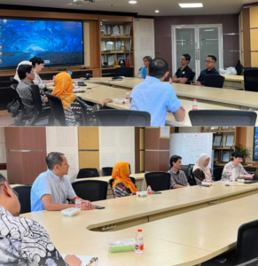 Colleagues seated around a conference table during a meeting